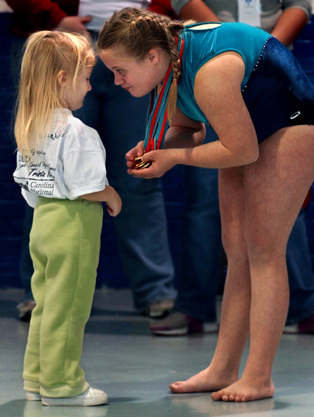 Trista Kutcher shows her little sister, Samantha, her Special Olympics gold medals.