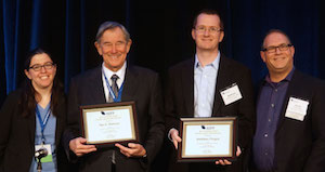 Paul E. Peterson and Matthew Chingos accept their award.