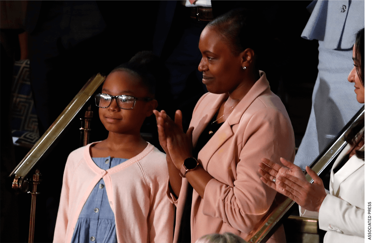 Janiyah, left, and Stephanie Davis of Philadelphia, listen as President Donald Trump delivers his State of the Union address to a joint session of Congress on Capitol Hill in Washington, Tuesday, Feb. 4, 2020