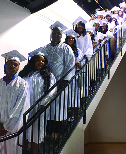 ￼Students from the NET Charter High School on graduation day in February 2014. (Photo/Shane Colman, Courtesy Net Charter High School)