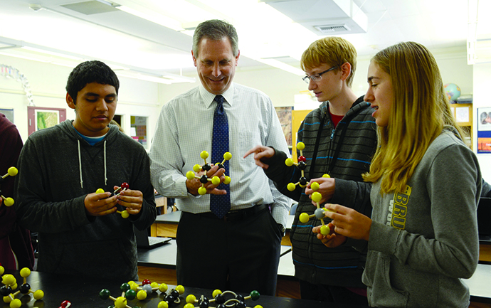 Riverside STEM Academy principal Dale Moore with students.