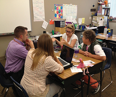 In Denver, teachers from the charter school Highline Academy and the district school Cole Academy of Arts and Science collaborate on curriculum plans and interim assessments