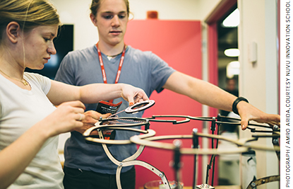 At NuVu, two students work on a transformative chair.