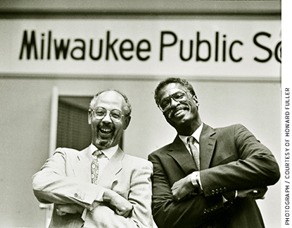 Howard Fuller with Bob Peterkin (left), the outgoing superintendent of the Milwaukee Public Schools, on the night in 1991 that Fuller was named the district’s new superintendent
