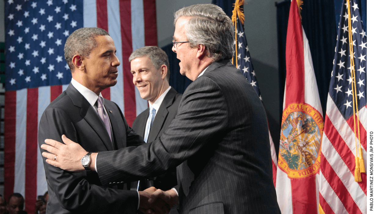 President Obama is introduced by former Florida Gov. Jeb Bush, right, before speaking at Miami Central Senior High School in 2011. Education Secretary Arne Duncan is at center.