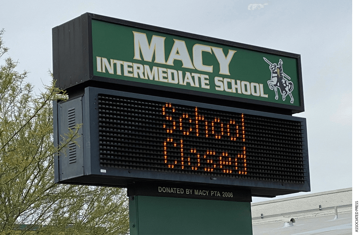 "School Closed" sign at Macy Intermediate in the wake of the coronavirus COVID-19 pandemic outbreak, Wednesday, March 18, 2020, in Monterey Park, Calif.