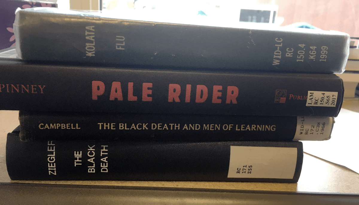 A stack of four books