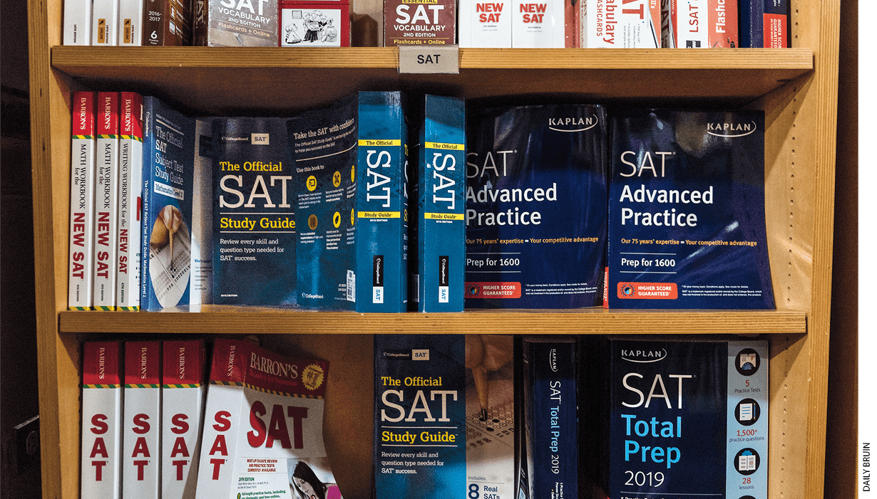 Several SAT preparation books on a bookshelf.