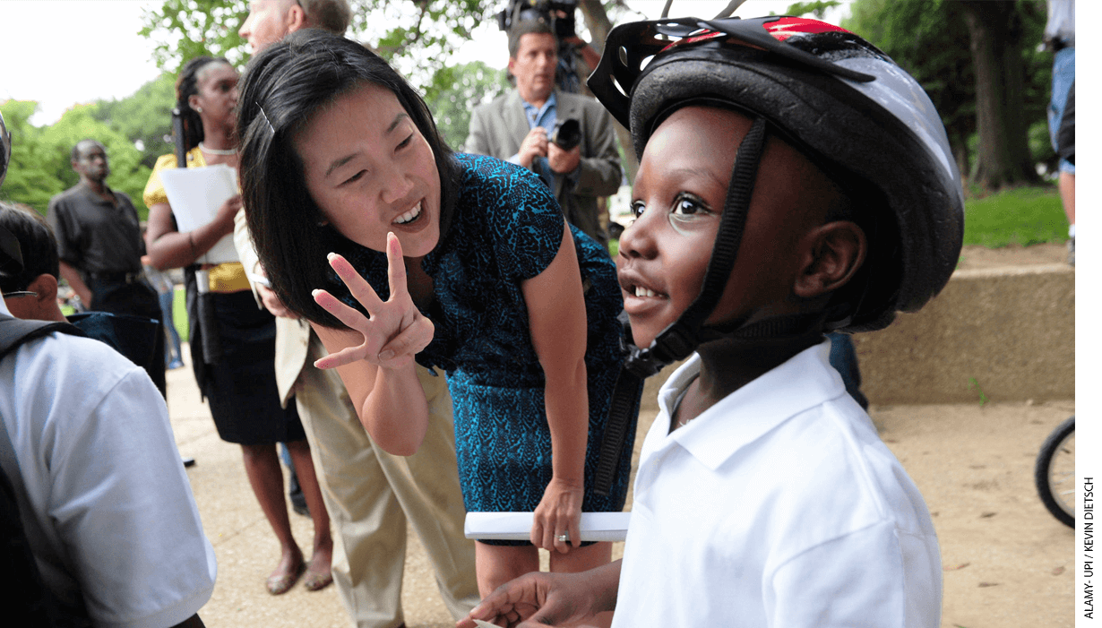 D.C. Public Schools Chancellor Michelle Rhee talked to Joshua Young, 4, during a walk-to- school event in Washington on August 24, 2010.