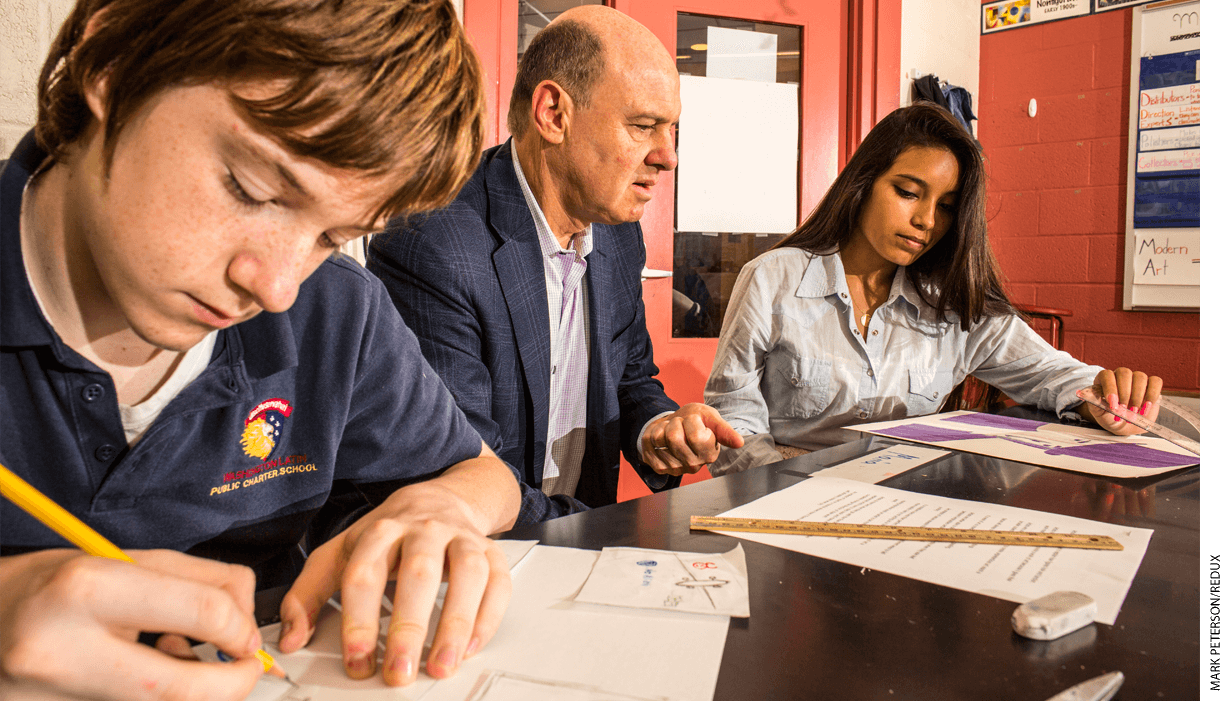 Scott Pearson (center), head of the D.C. Public Charter School Board, at Washington Latin Public Charter School.