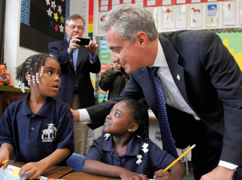 Chicago Mayor Rahm Emanuel meets with students in a school.