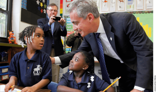 Chicago Mayor Rahm Emanuel meets with students in a school.