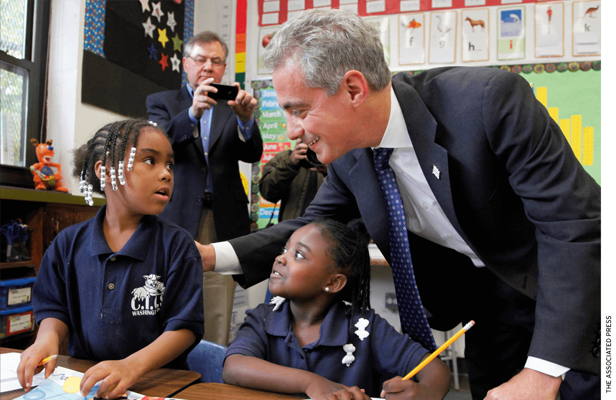 Chicago Mayor Rahm Emanuel meets with students in a school.
