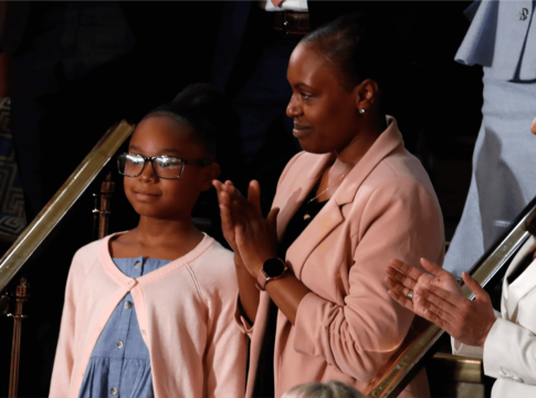 Janiyah, left, and Stephanie Davis of Philadelphia, listen as President Donald Trump delivers his State of the Union address to a joint session of Congress on Capitol Hill in Washington, Tuesday, Feb. 4, 2020