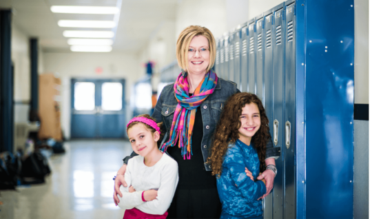 Kendra Espinoza with her two daughters at Stillwater Christian School in Kalispell, Mont.