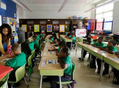 Teacher Shanel Sommers looks over the work of one of her third-graders at KIPP Thrive Academy in Newark, N.J.