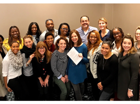 Kristyn Klei Borrero (center, holding a sheet of paper) and the CT3 team.