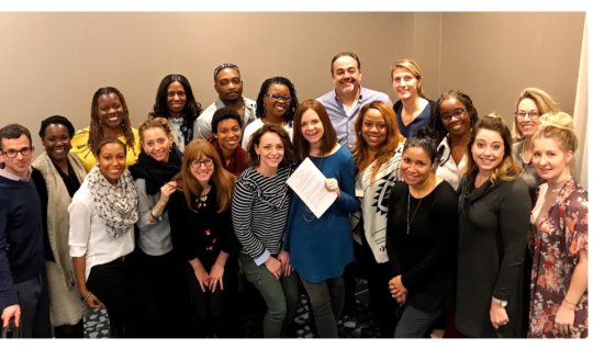 Kristyn Klei Borrero (center, holding a sheet of paper) and the CT3 team.