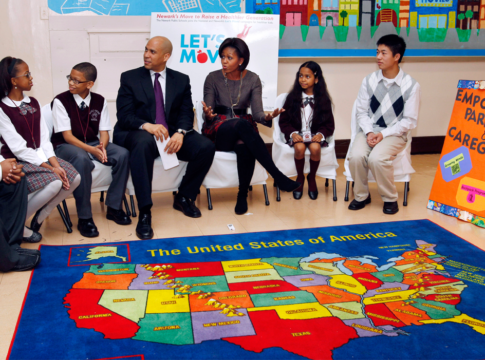 First Lady Michelle Obama and Newark Mayor Cory Booker sit with children at the Maple Avenue School in Newark, N.J., Thursday, Nov. 18, 2010.
