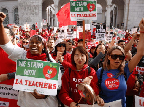 Teachers, parents and students picket outside City Hall in Los Angeles, Friday, Jan. 18, 2019, as part of a strike against Los Angeles Unified School District.