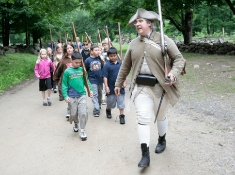 Park Ranger Jim Hollister leads a school group at Minute Man National Historical Park in Massachusetts.