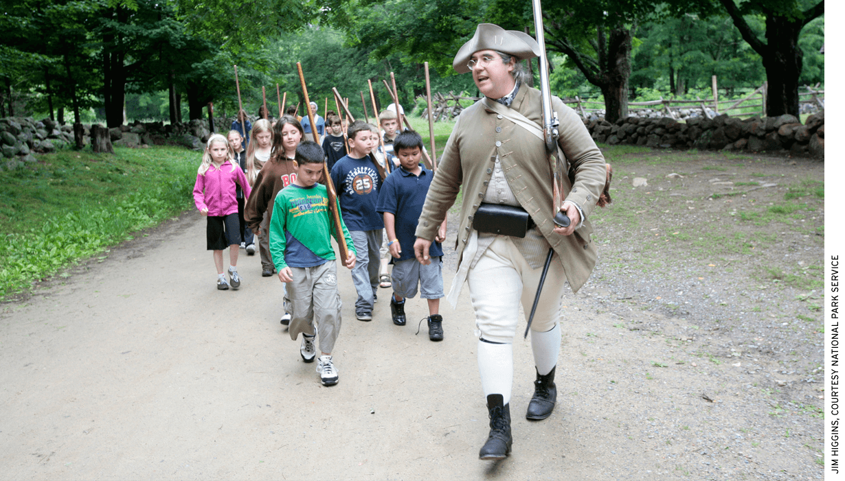Park Ranger Jim Hollister leads a school group at Minute Man National Historical Park in Massachusetts.