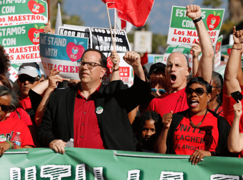The president of United Teachers Los Angeles, Alex Caputo-Pearl, center, joins unionized teachers at a rally in the city in 2018.