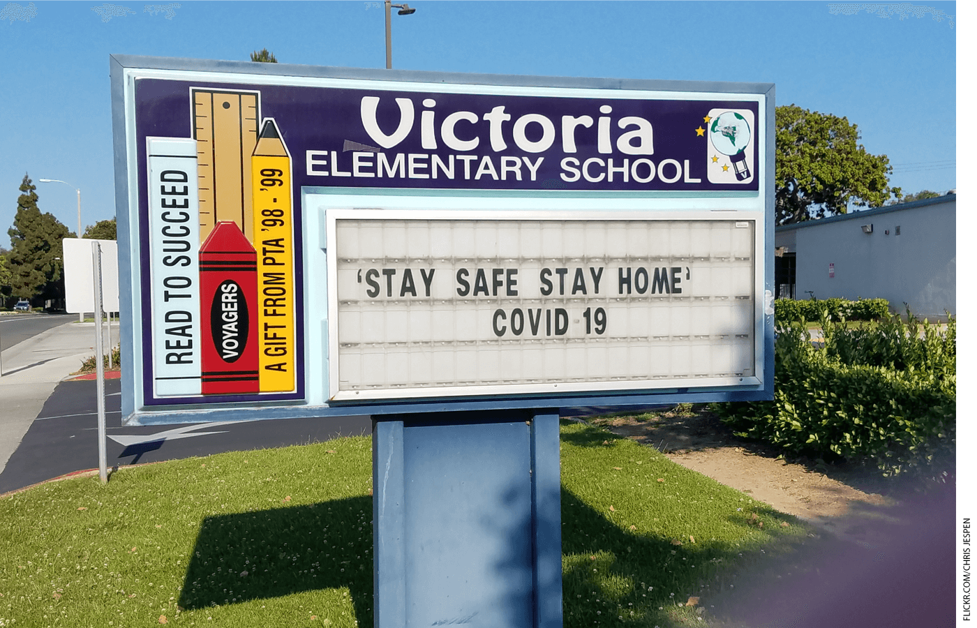 School sign which reads "Stay Safe Stay Home Covid 19"
