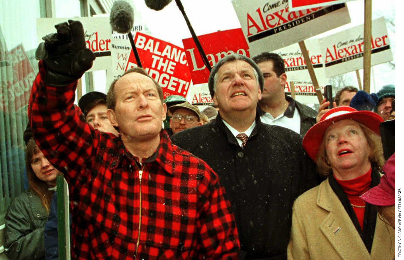 Alexander waves to supporters in Milford, New Hampshire, during his presidential campaign, February 14, 1996.