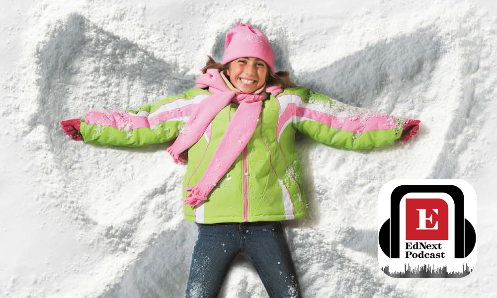 Child making snow angel