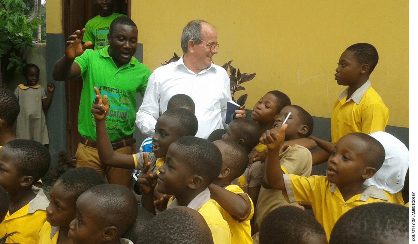 Professor James Tooley with students at an Omega private school in Bawjiase, Ghana.