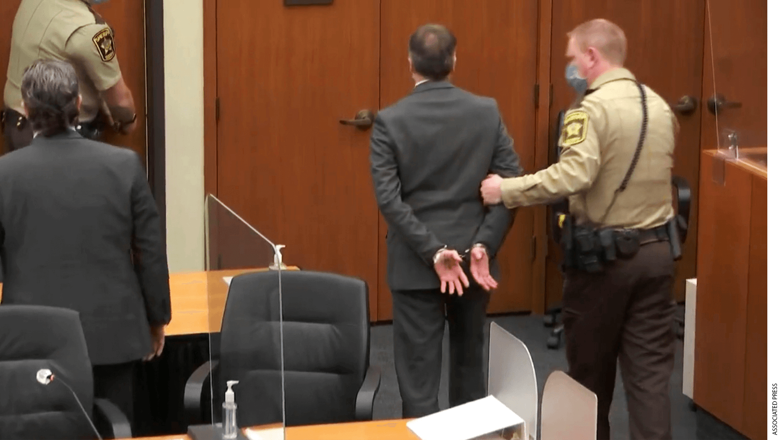 In this image from video, former Minneapolis police Officer Derek Chauvin, center, is taken into custody as his attorney, Eric Nelson, left, looks on, after the verdicts were read at Chauvin's trial for the 2020 death of George Floyd, Tuesday, April 20, 2021, at the Hennepin County Courthouse in Minneapolis, Minn.
