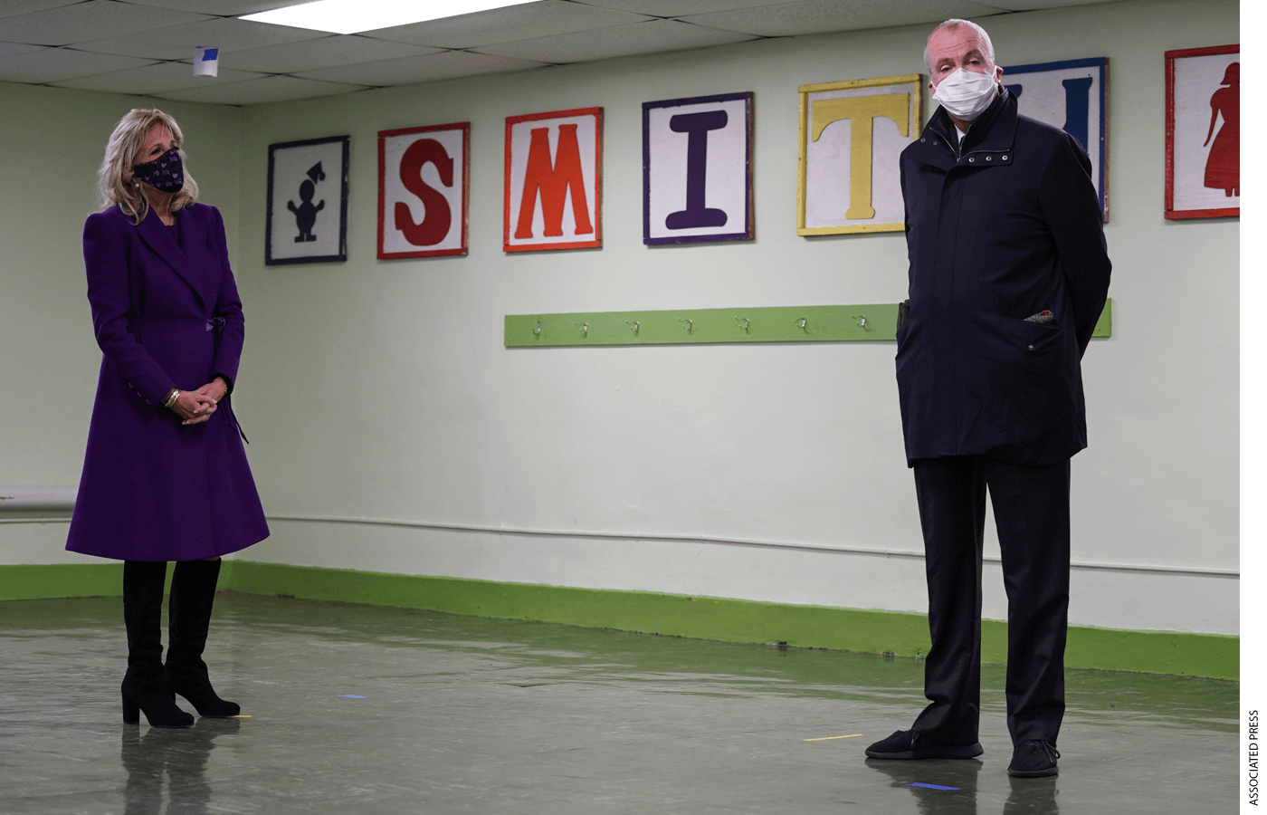 First Lady Jill Biden tours a cafeteria at the Samuel Smith Elementary School in Burlington, N.J., with New Jersey Gov. Phil Murphy