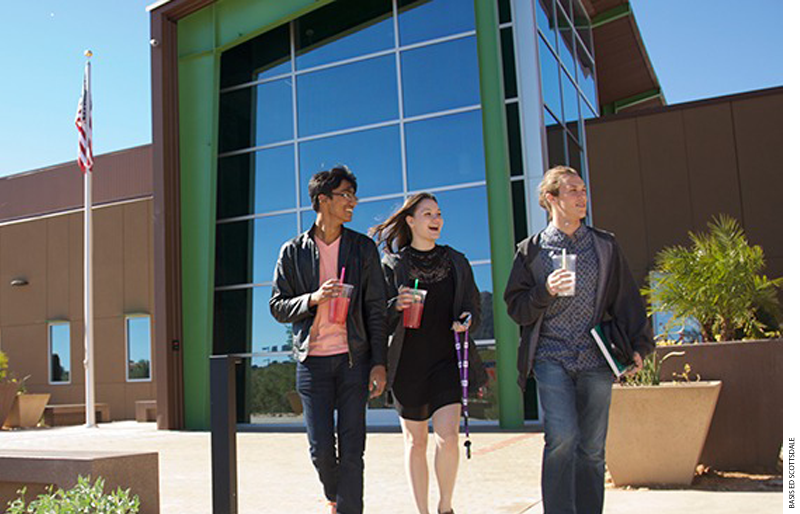 Students walk out of a school building