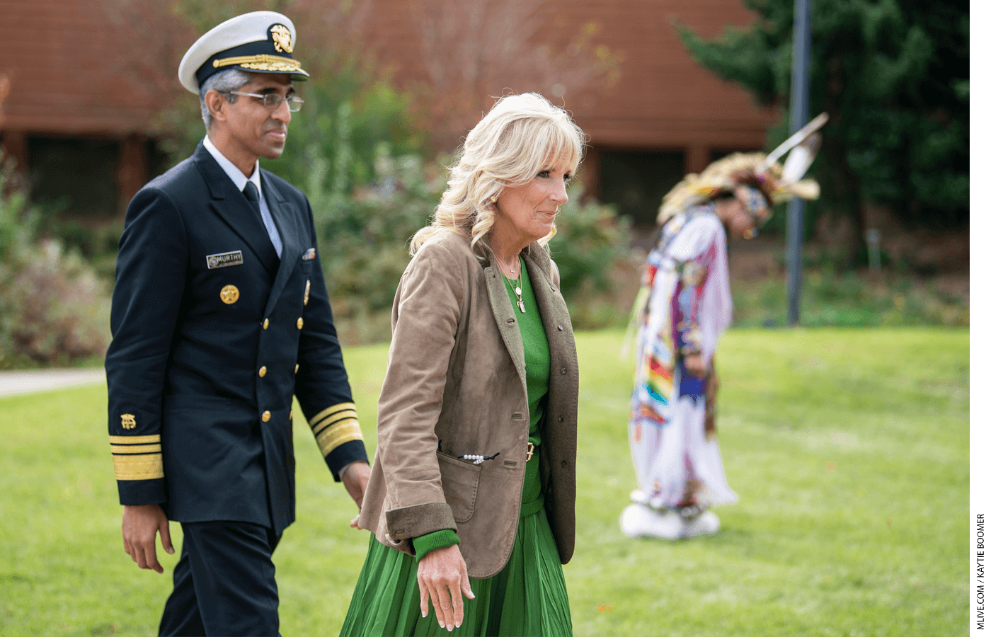 First Lady Jill Biden and Surgeon General Vivek Murthy walks over to the sidewalk before watching a performance by the tribe during a visit to the Ziibiwing Center in Mt. Pleasant for a listening session focused on youth mental health with members of the Saginaw Chippewa Indian Tribe on Sunday, Oct. 24, 2021.