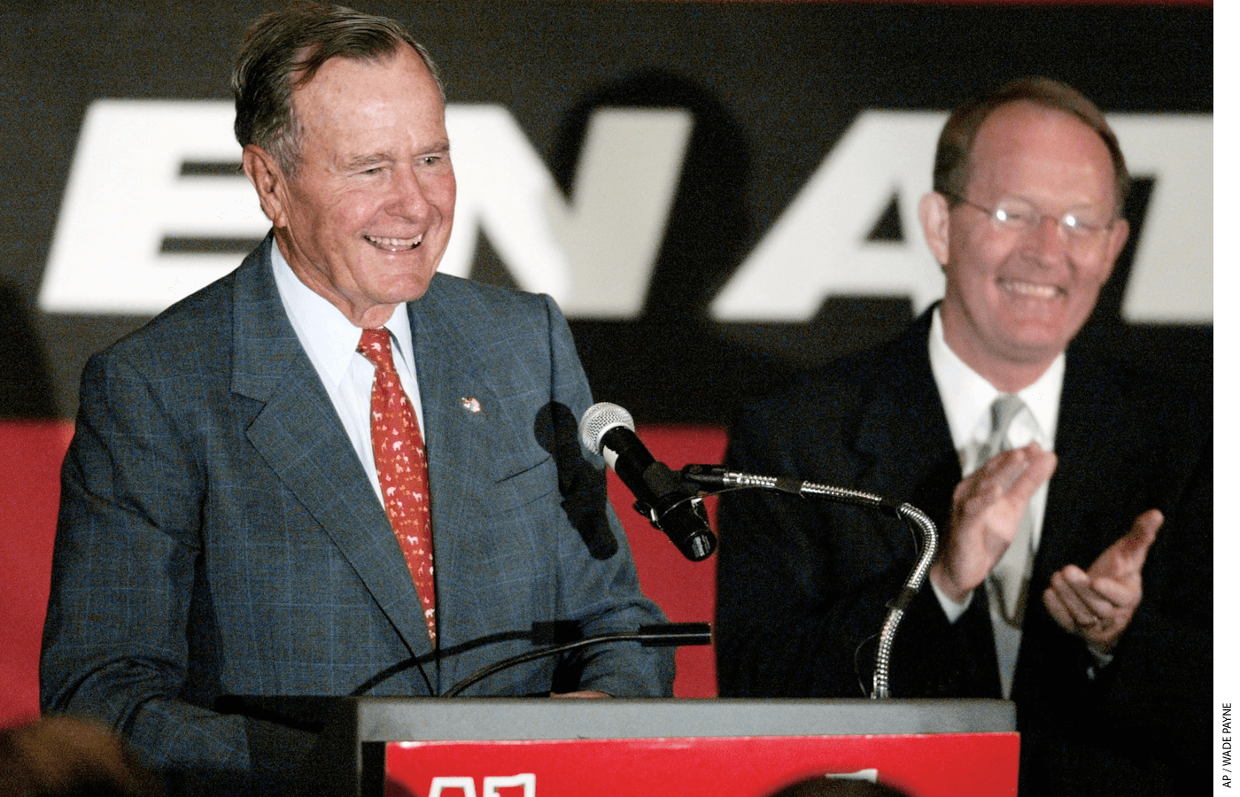 President George H.W. Bush stands next to Lamar Alexander