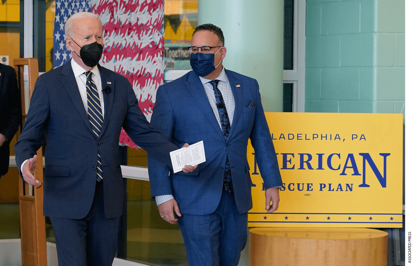 President Joe Biden arrives with Education Secretary Miguel Cardona to visit with students at Luis Muñoz Marin Elementary School in Philadelphia, Friday, March 11, 2022.
