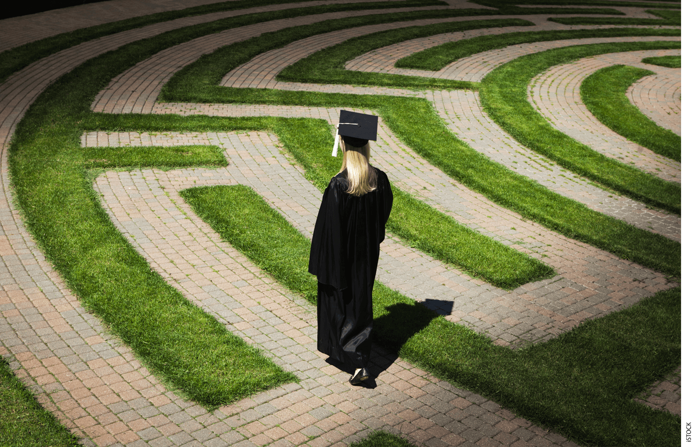 Illustration of a college graduate walking through a maze