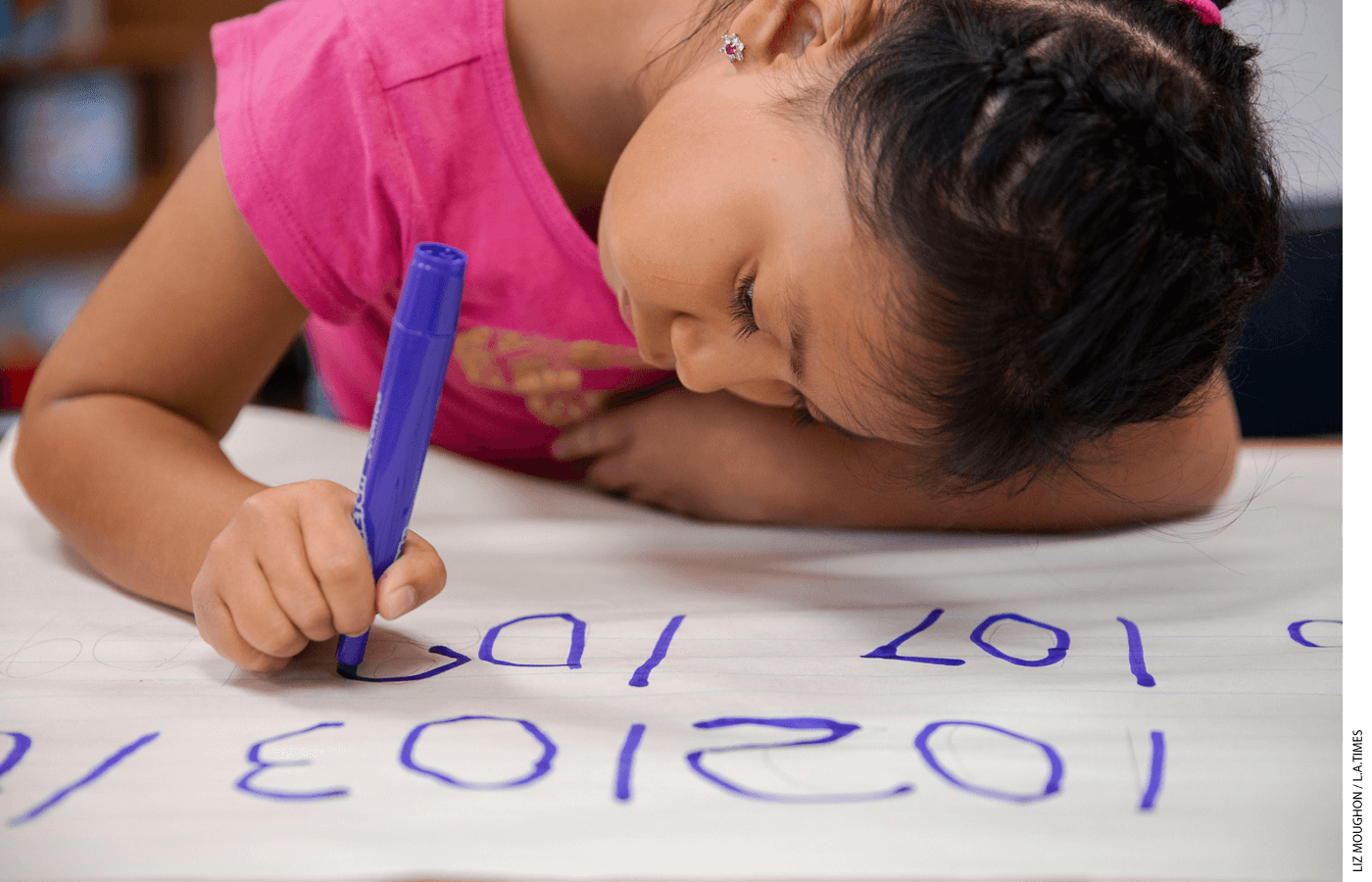 Emily Osorio-Hernandez, 6, writes numbers for a math assignment at a California elementary school in 2019. The Golden State unveiled new proposed math guidelines in 2021.