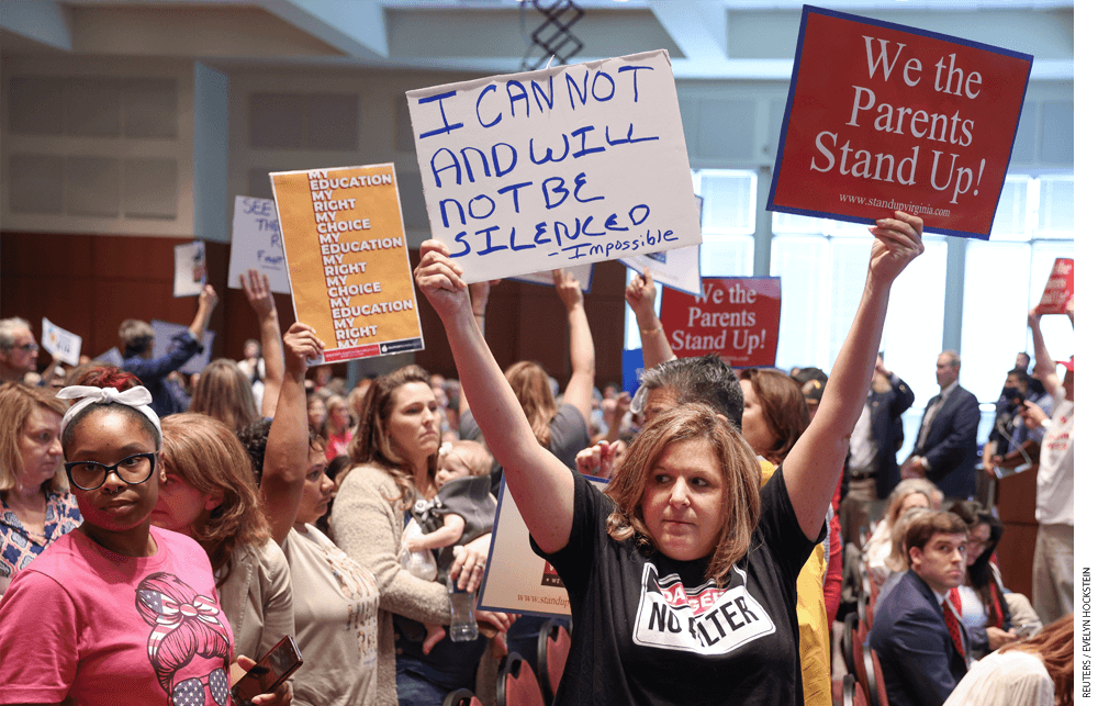Parents protest at a meeting of the Loudoun County School Board in Ashburn, Virginia.