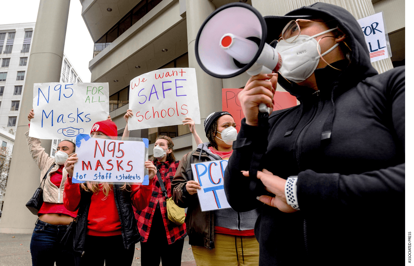 Teachers protest for stronger Covid-19 safety protocols outside Oakland Unified School District headquarters on Jan. 7, 2022, in Oakland, Calif.