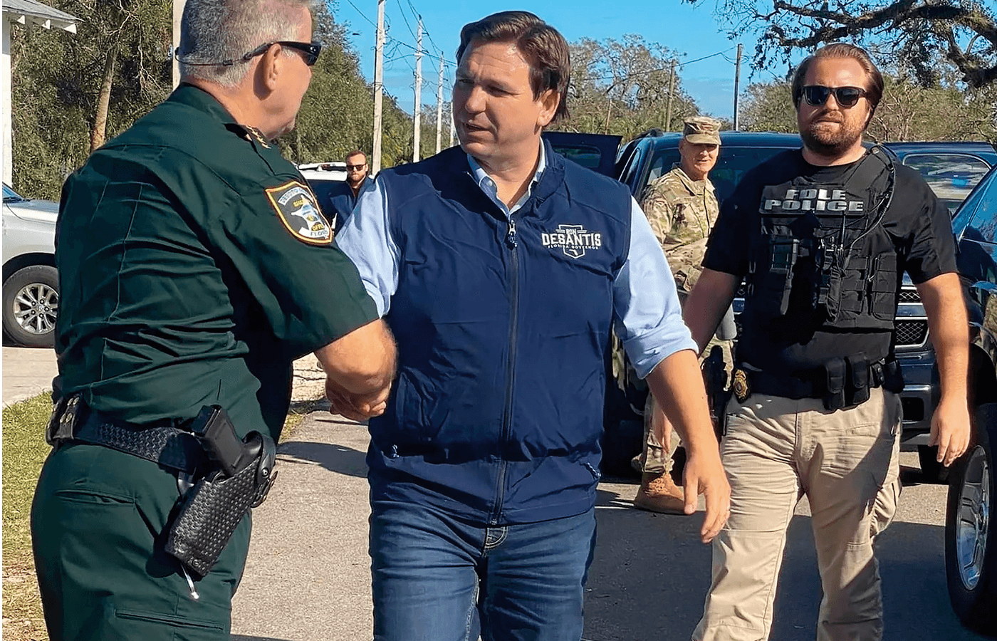 Governor Ron DeSantis greets DeSoto County Sheriff James Potter in October 2022 before touring southwest Florida to survey the damage from Hurricane Ian.