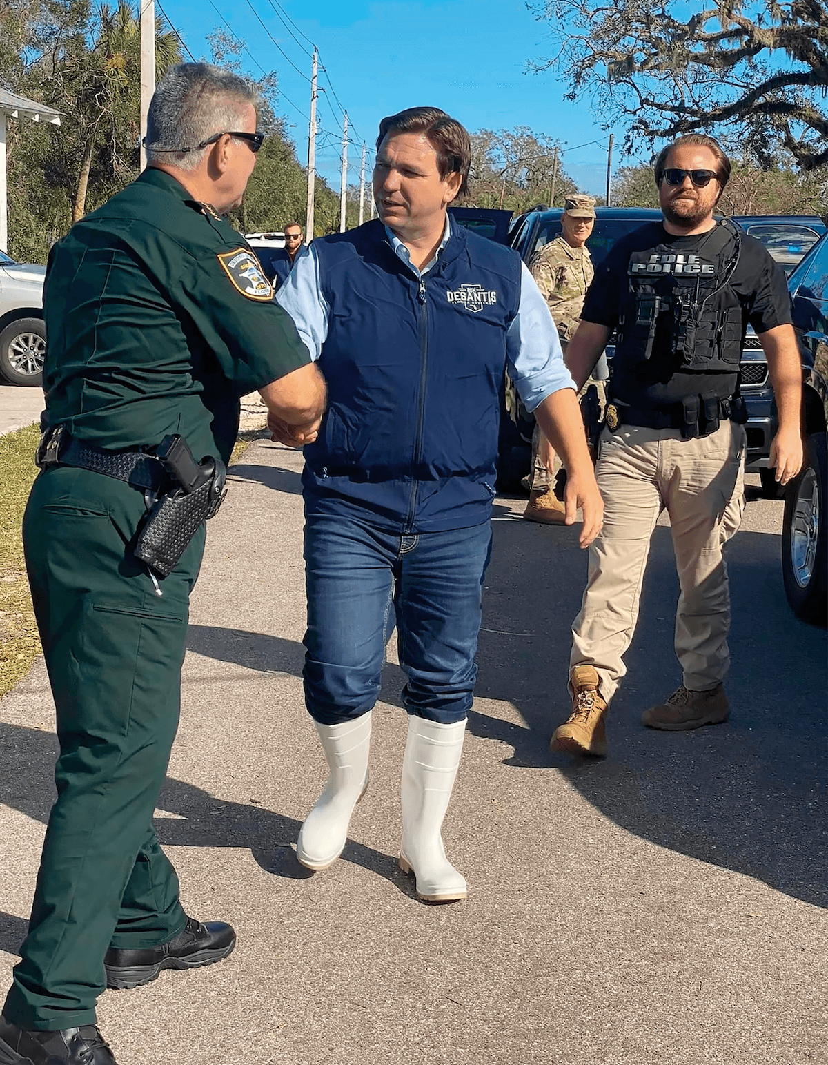 Governor Ron DeSantis greets DeSoto County Sheriff James Potter in October 2022 before touring southwest Florida to survey the damage from Hurricane Ian.