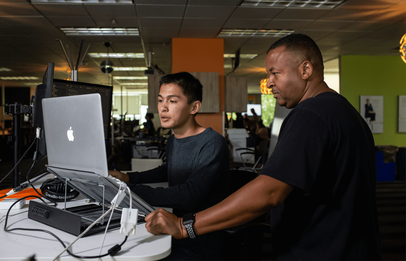 Colin Dean (left) was in high school when he started an apprenticeship as a coder through CareerWise at Angi Leads, a home service company. His supervisor was Sheldon Fitzpatrick (right).