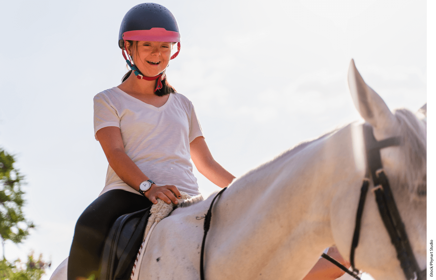 Photo of a girl sitting on a horse