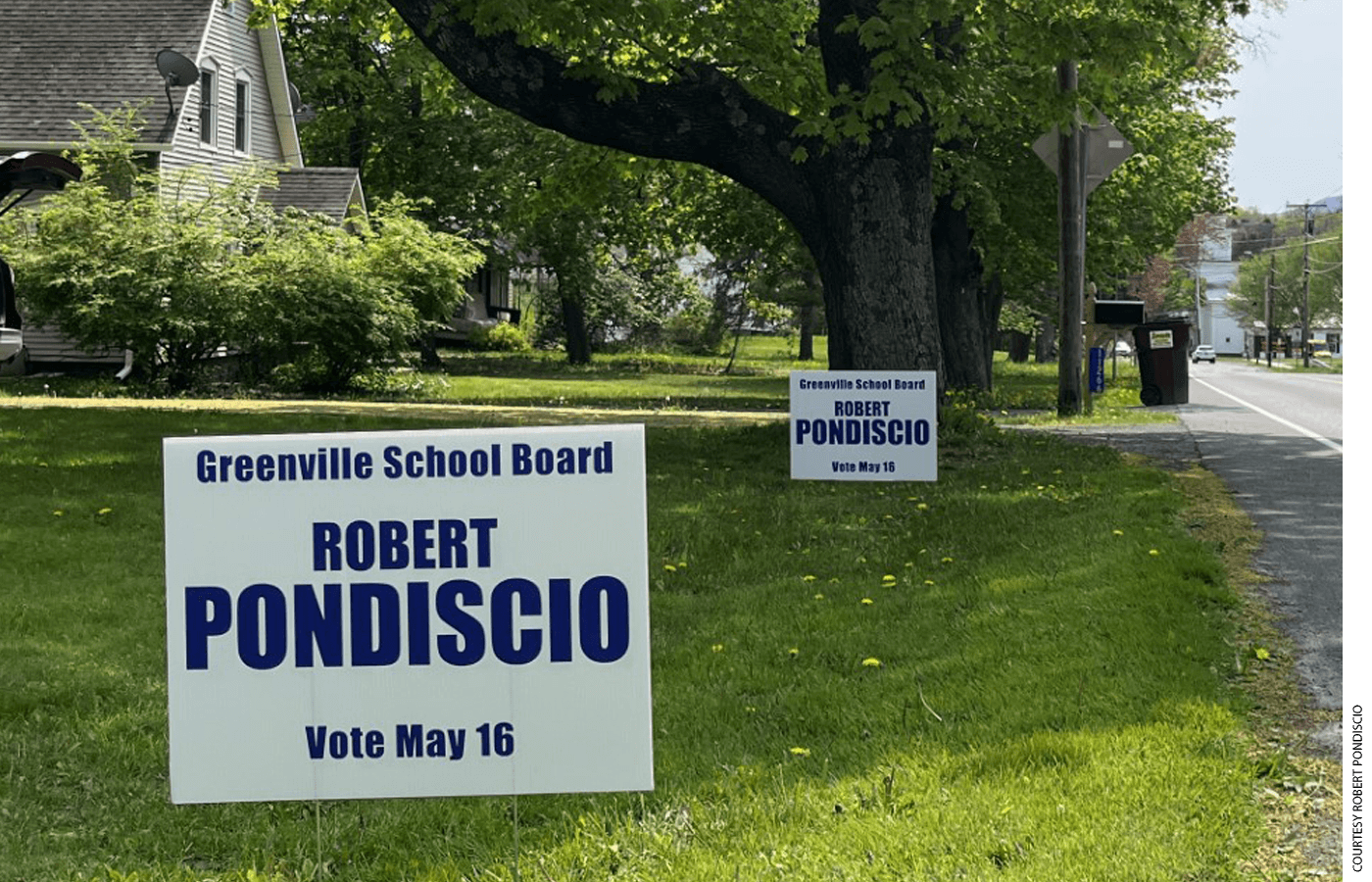 Campaign signs for Robert Pondiscio on a lawn
