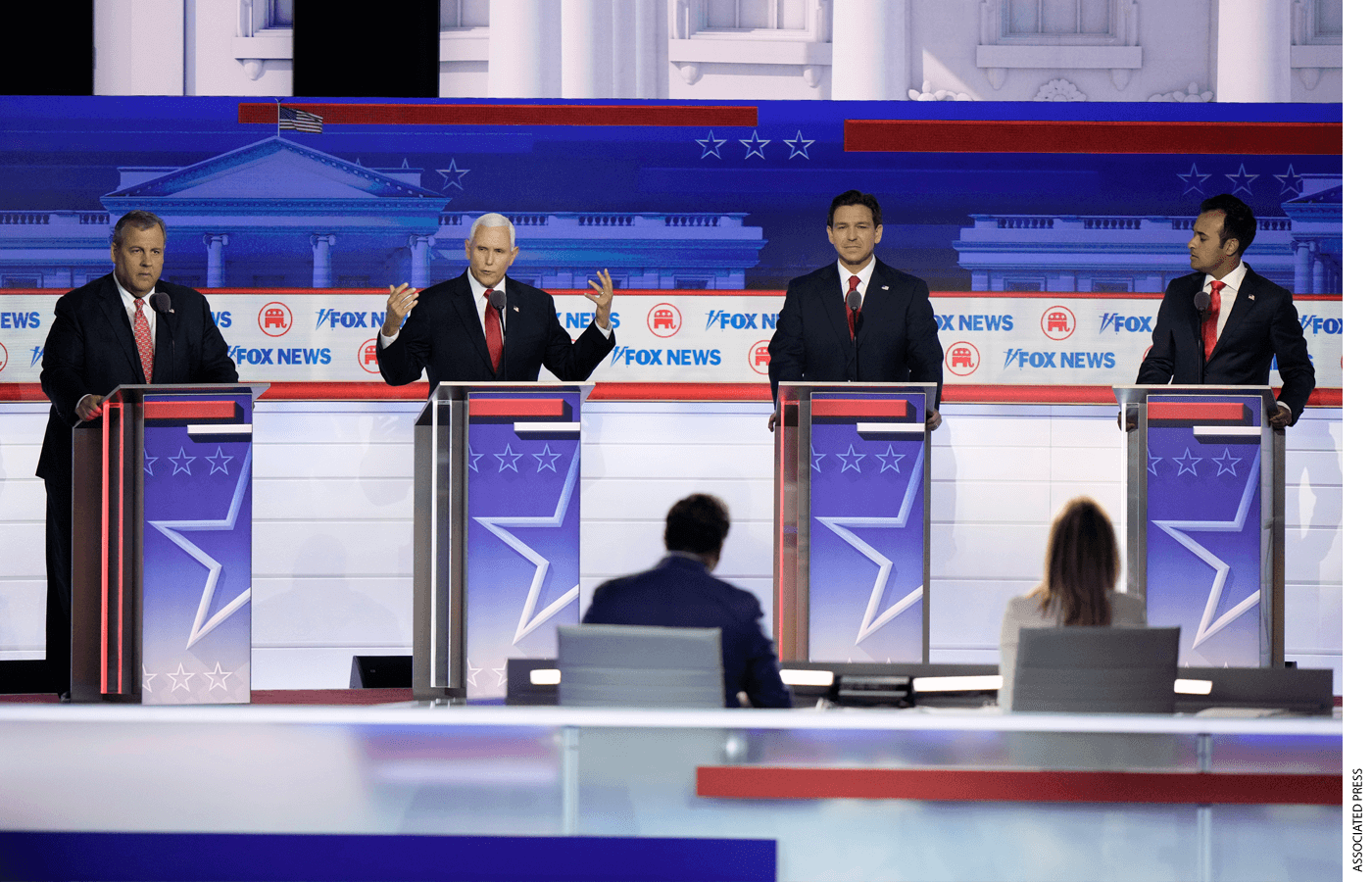 Former Vice President Mike Pence speaks as from left, former New Jersey Gov. Chris Christie, Florida Gov. Ron DeSantis and businessman Vivek Ramaswamy listen during a Republican presidential primary debate hosted by FOX News Channel Wednesday, Aug. 23, 2023, in Milwaukee.