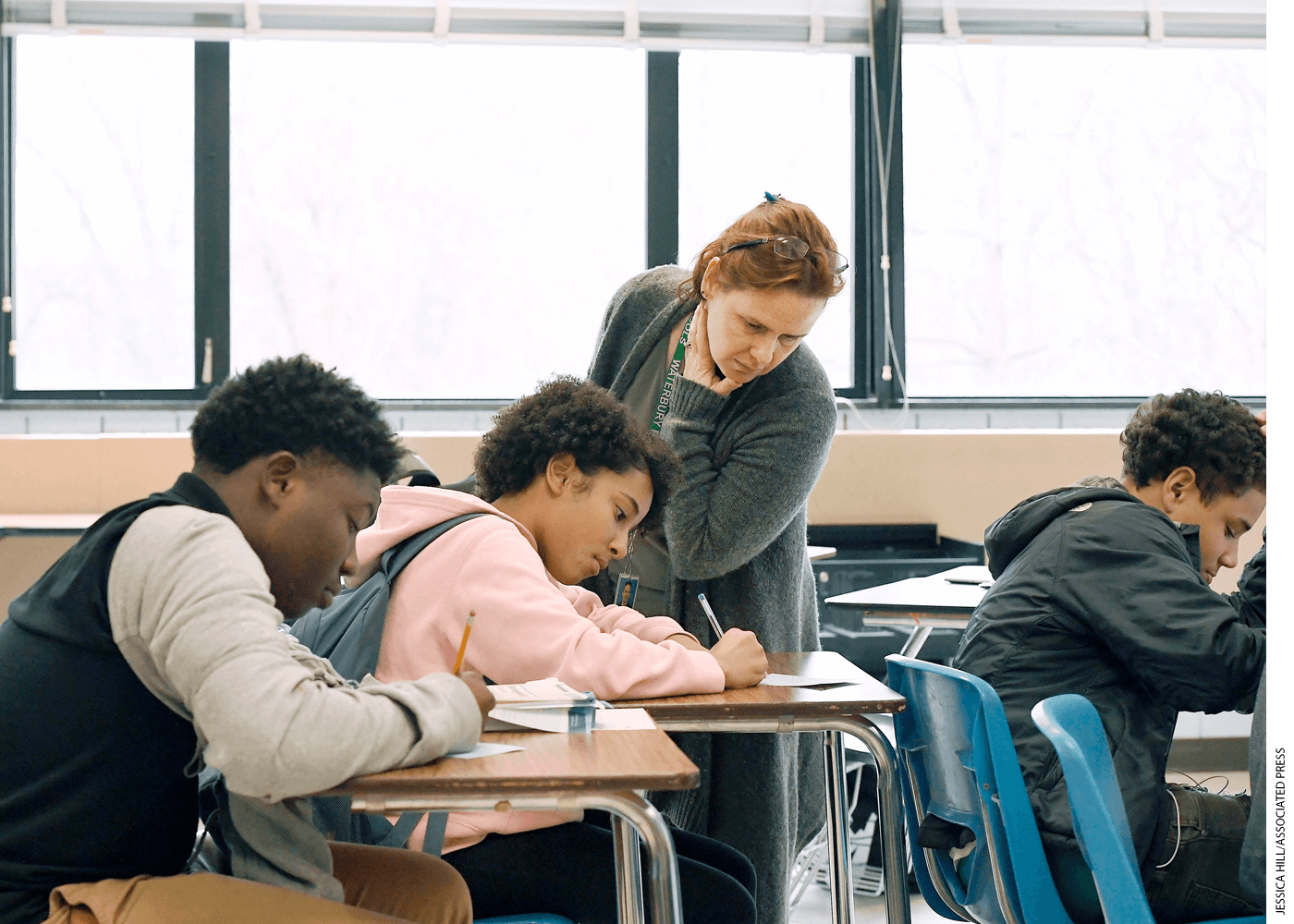 At Crosby High School in Waterbury, Connecticut, Jennifer Desiderio works with an Algebra student. Nationwide, 79 percent of all teachers are white compared to 44 percent of students.