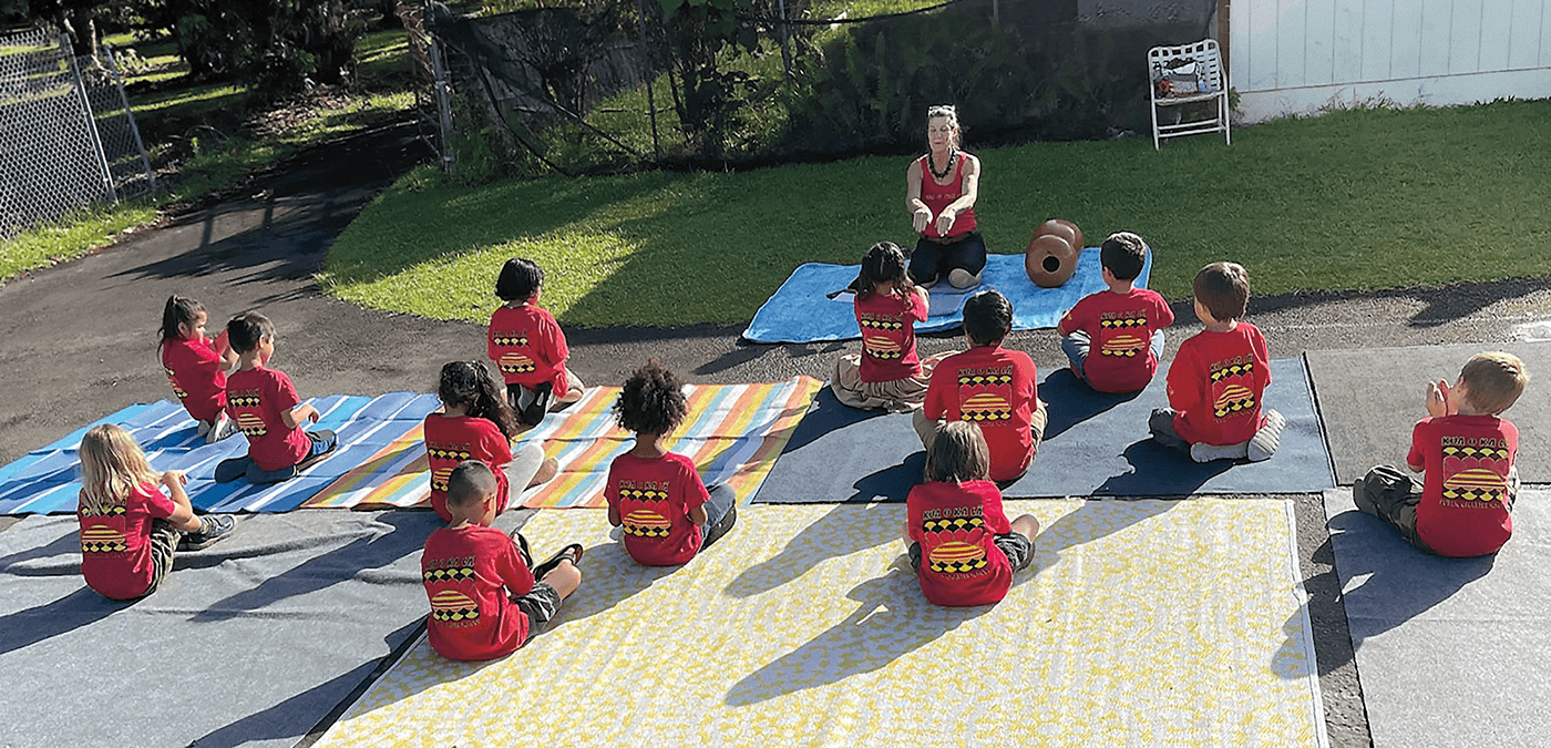 Students at Kua O Ka Lā listen to instructions about hula, Hawaii’s traditional storytelling dance set to an oli (chant) with mele (song).