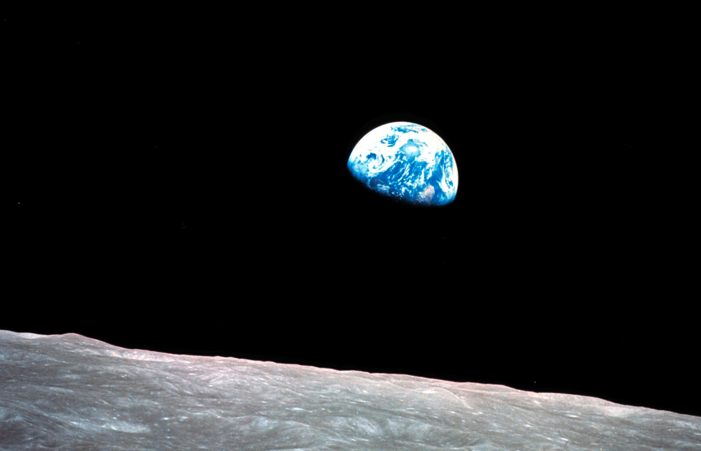 FILE - This Dec. 24, 1968, file photo made available by NASA shows the Earth behind the surface of the moon during the Apollo 8 mission. (William Anders/NASA via AP, File)